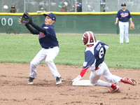 Carter March of the Twins receives the throw  as Tyler Eaton of the Red Sox slides into 2nd base on a steal attempt. Tyler was safe, just beating the tag.  This took place during a Granada Little Leag