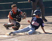 Chase Nadeau scores from 2nd base just ahead of the tag by Luke Anderson on a base hit.  This took place in a game between the AAA Twins and Orioles in Granada Little League action.