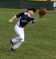Second Baseman Colin Johnston makes a running catch on a pop fly in shallow right field.  This took place during a Granada Little League game between the Red Sox and the Diamondbacks in the Majors div