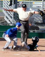 Umpire Mark Rose makes the call at the plate as Colin Johnston of the Cubs and Luke Palma of the As look on during a Granada Little League Majors game.