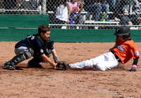 Owen Summers applies the tag on Cole Carnahan during a close play at the plate.  The play started with a ground ball to shortstop Denny Derham who made a quick throw home.