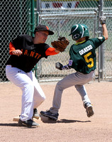 Alex Grasso steals 3rd base as Colby Wallace is about to make the tag in a Granada Little game between the A’s and Giants in the Major’s division.