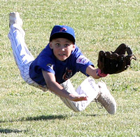 Center fielder Cole Camilleri dives for a fly ball in a Granada Little AAA Game between the Cubs and the Pirates.