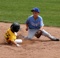 Max Ghiglieri slides into 2nd base as shortstop Ben Johnston prepares to apply the tag in a Granada Little League Major’s game between the Pirates and the Royals.
